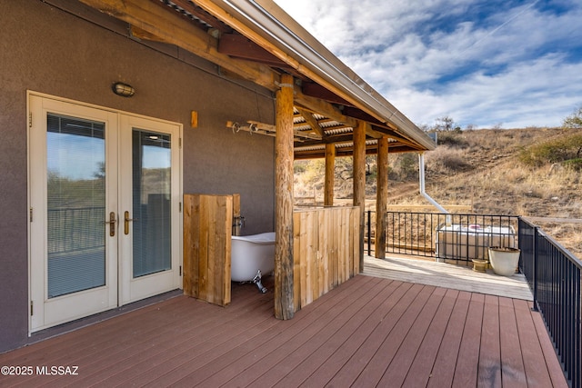 wooden terrace featuring french doors