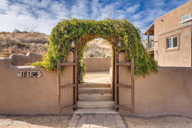 view of gate with fence