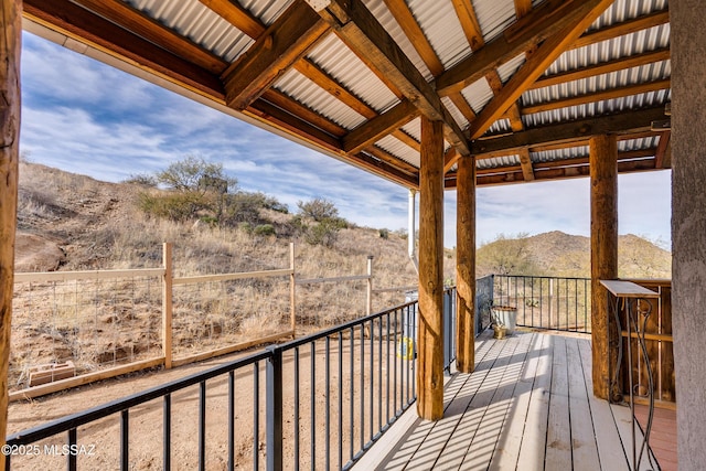 wooden deck with a mountain view