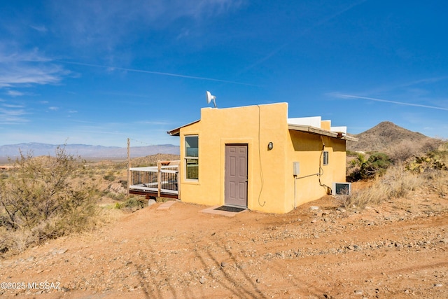 view of outbuilding with a mountain view