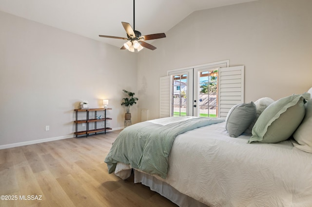 bedroom with ceiling fan, french doors, lofted ceiling, access to outside, and light wood-type flooring