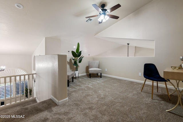 office space featuring lofted ceiling, carpet floors, and ceiling fan with notable chandelier