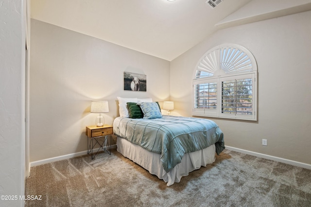 carpeted bedroom featuring lofted ceiling