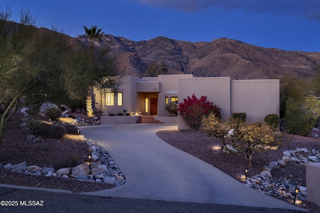 pueblo-style house featuring a mountain view