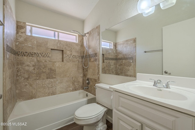 full bath with washtub / shower combination, vanity, and toilet