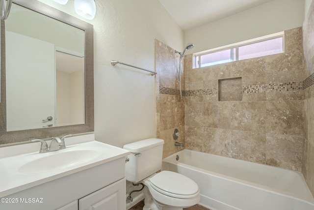 bathroom featuring toilet, shower / bath combination, and vanity