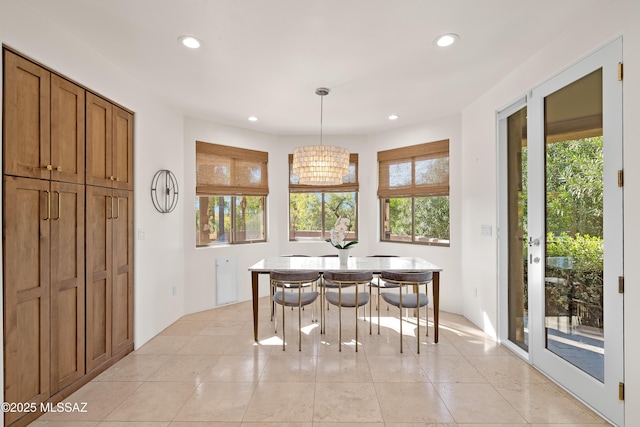 dining space featuring breakfast area, recessed lighting, and light tile patterned floors