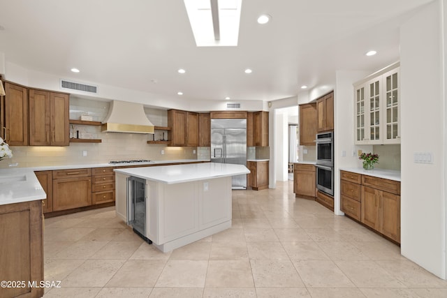 kitchen with visible vents, beverage cooler, custom range hood, appliances with stainless steel finishes, and open shelves