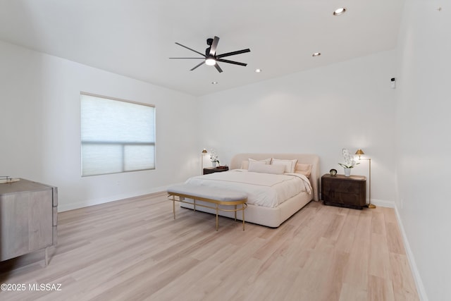 bedroom featuring light wood finished floors, recessed lighting, and baseboards