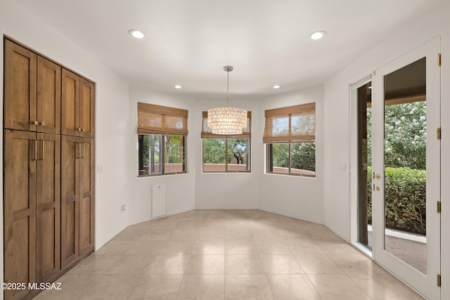 6872 E Desert Wind Ct, Tucson, AZ 85750 - unfurnished dining area featuring recessed lighting, a chandelier, and light tile patterned floors