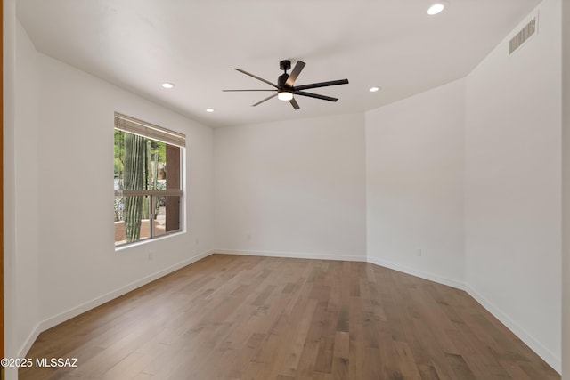 6872 E Desert Wind Ct, Tucson, AZ 85750 - spare room featuring a ceiling fan, wood finished floors, recessed lighting, and baseboards