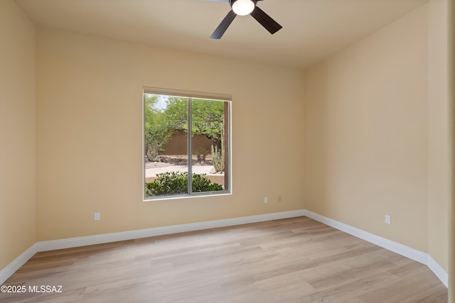 6872 E Desert Wind Ct, Tucson, AZ 85750 - unfurnished room with light wood-style flooring, baseboards, and a ceiling fan