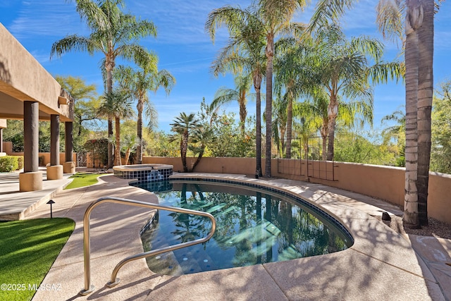 view of swimming pool with a patio, fence private yard, and a pool with connected hot tub