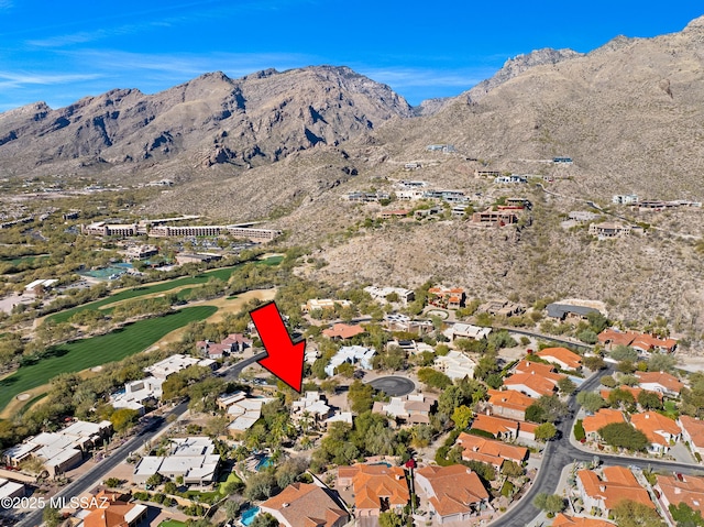 drone / aerial view featuring a residential view and a mountain view