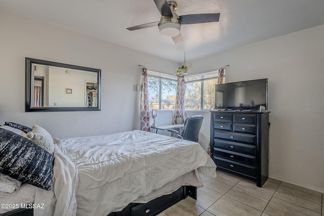 bedroom with ceiling fan and light tile patterned flooring