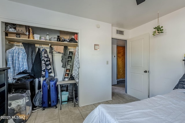 bedroom featuring light tile patterned floors