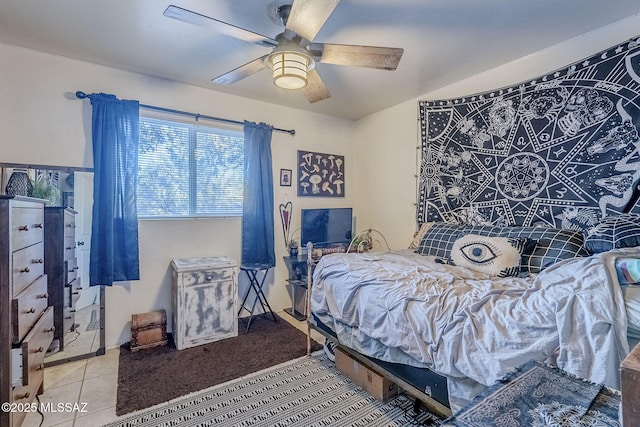 tiled bedroom with ceiling fan