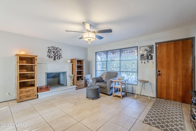 living room with ceiling fan and light tile patterned flooring