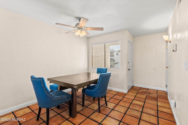 tiled dining space with ceiling fan