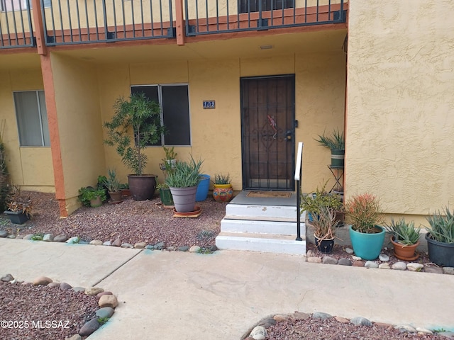 entrance to property with a balcony