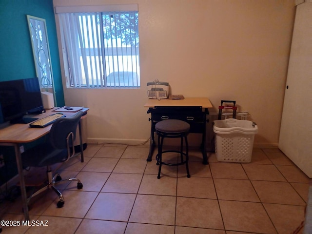 office area featuring light tile patterned flooring