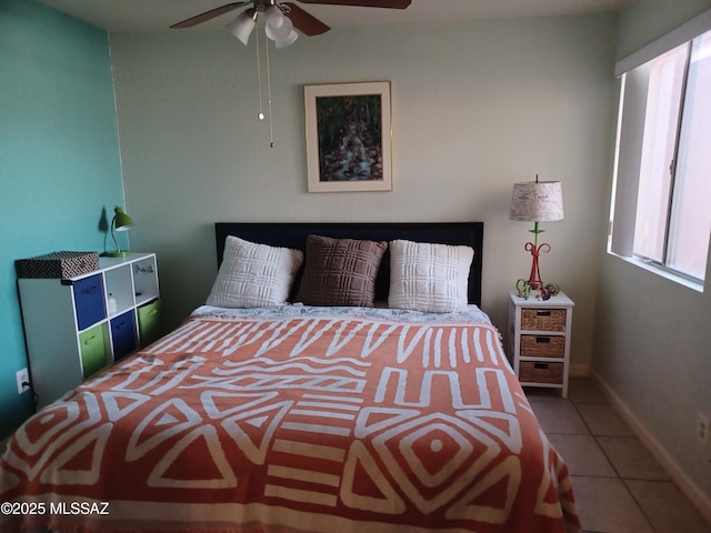 tiled bedroom with baseboards and ceiling fan