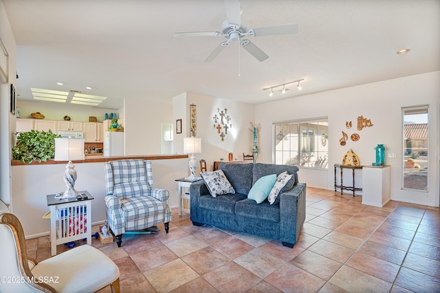 tiled living room with ceiling fan