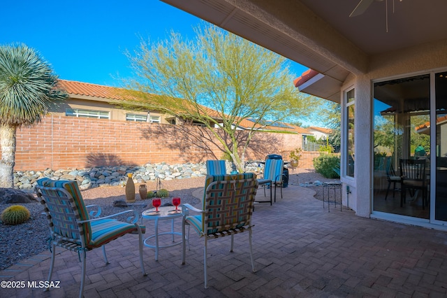 view of patio with ceiling fan