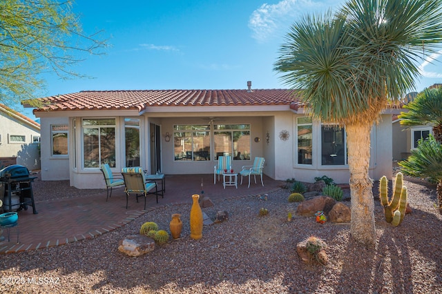 back of house featuring a patio area