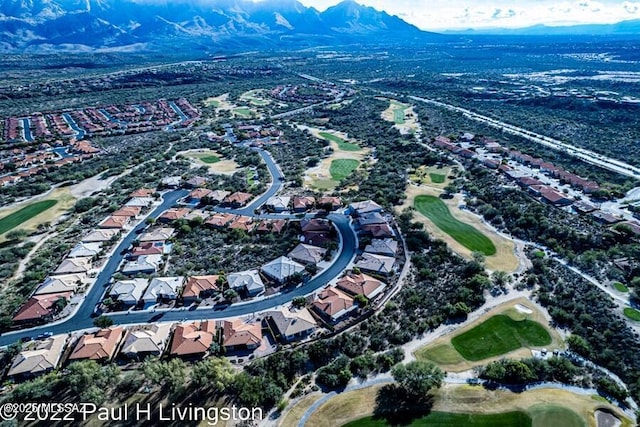 birds eye view of property with a mountain view