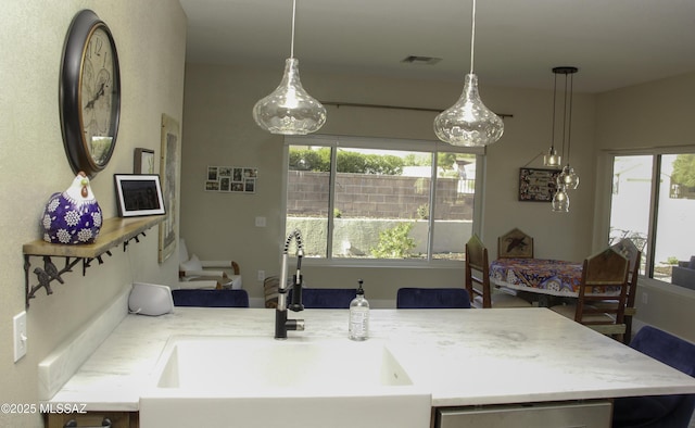 kitchen with sink and hanging light fixtures