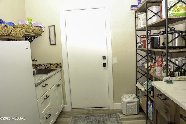 interior space featuring light hardwood / wood-style floors and sink