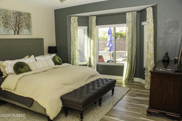 bedroom featuring wood-type flooring