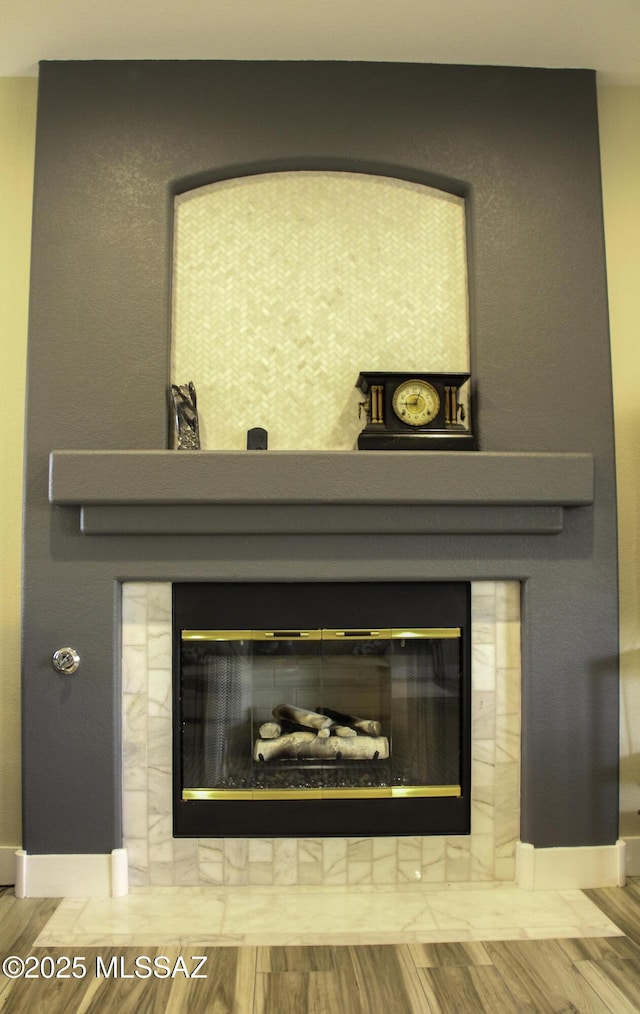 details featuring a tile fireplace