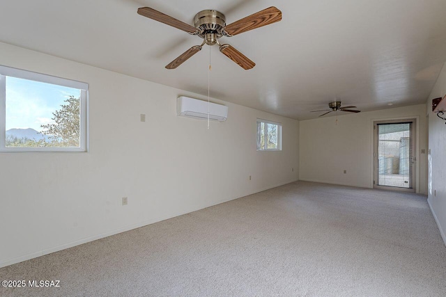 unfurnished room with ceiling fan, a wall unit AC, light carpet, and a healthy amount of sunlight