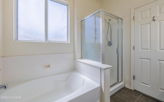 bathroom featuring tile patterned floors and independent shower and bath