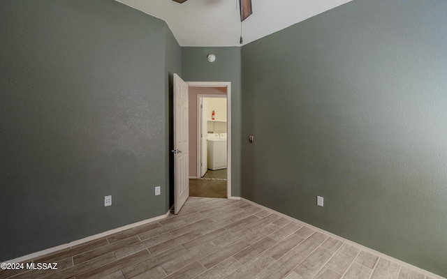 empty room featuring washer / clothes dryer and ceiling fan