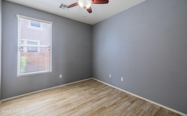 spare room featuring ceiling fan and light hardwood / wood-style flooring