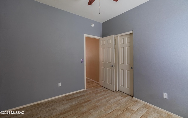 unfurnished bedroom featuring ceiling fan and light hardwood / wood-style flooring