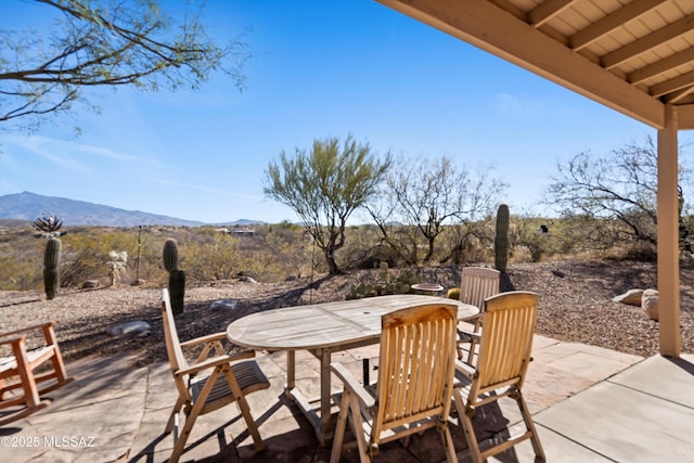 view of patio / terrace featuring a mountain view