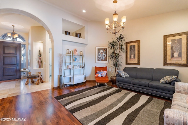 living room featuring hardwood / wood-style floors and a notable chandelier