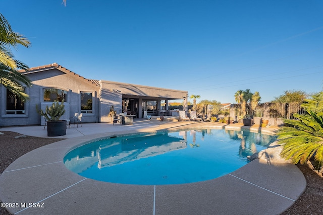 view of pool featuring a patio