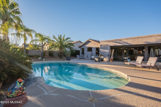 view of swimming pool featuring a patio