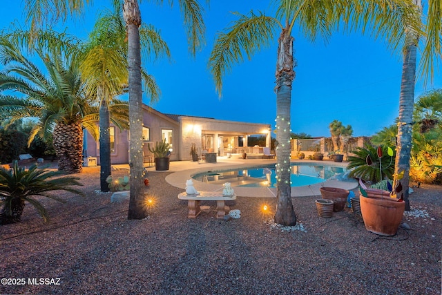 view of swimming pool featuring a patio area