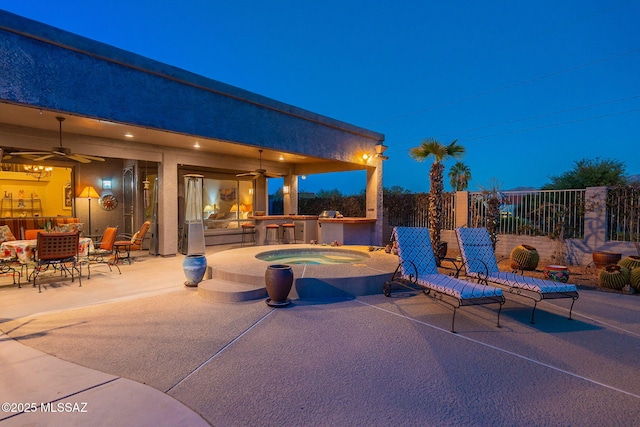 view of patio with ceiling fan and exterior kitchen