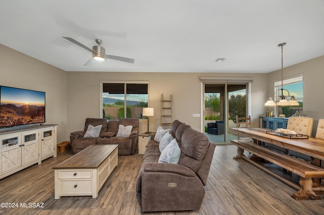 living room with ceiling fan and hardwood / wood-style floors