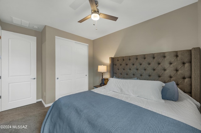 carpeted bedroom featuring ceiling fan and a closet