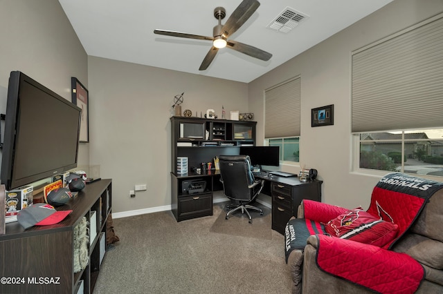 office with ceiling fan and dark colored carpet