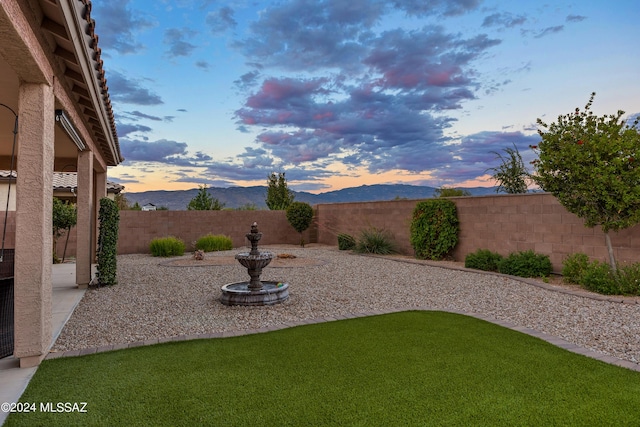 yard at dusk with a mountain view