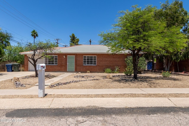 single story home featuring a garage